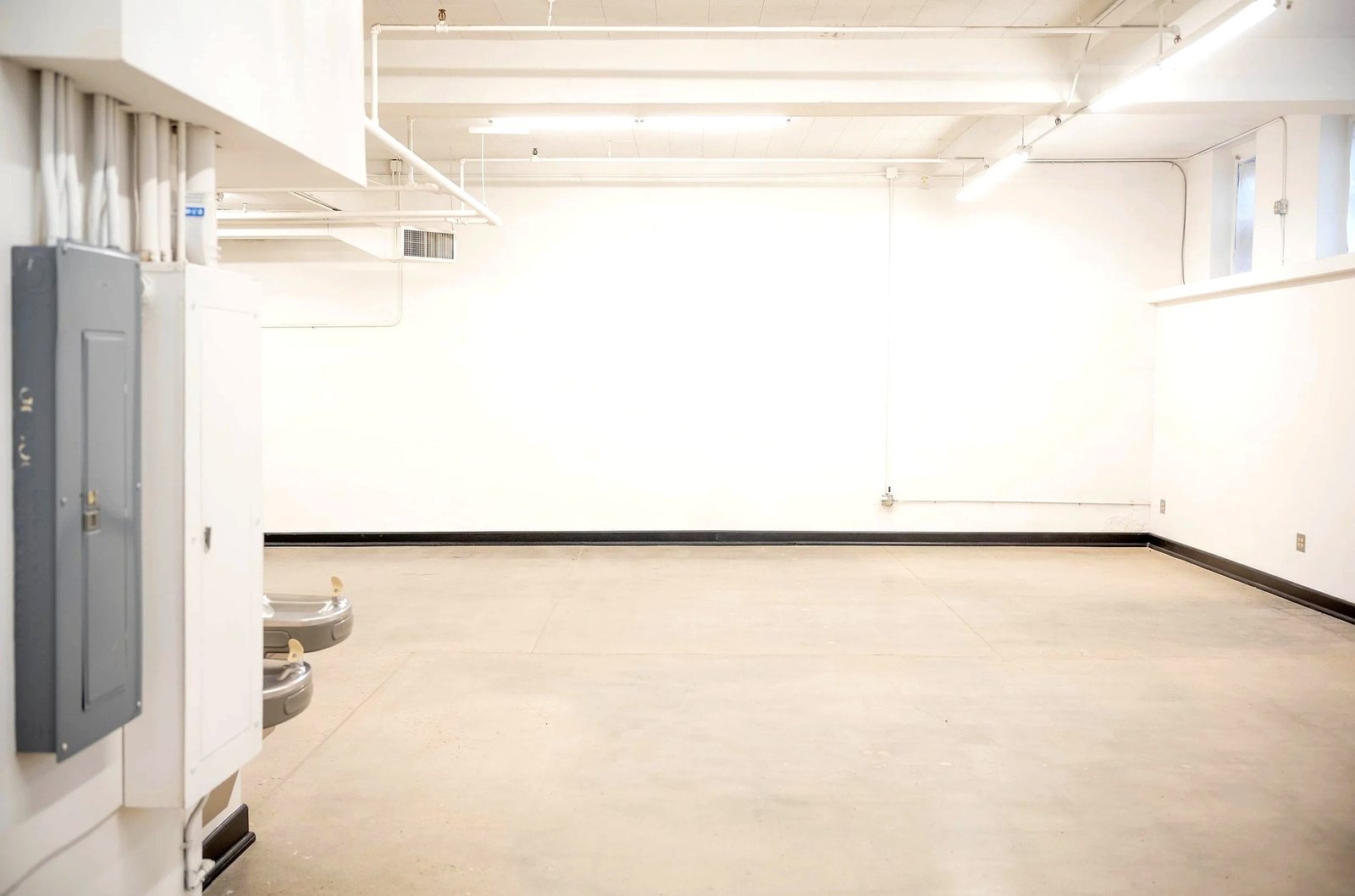Lower level open space with high windows