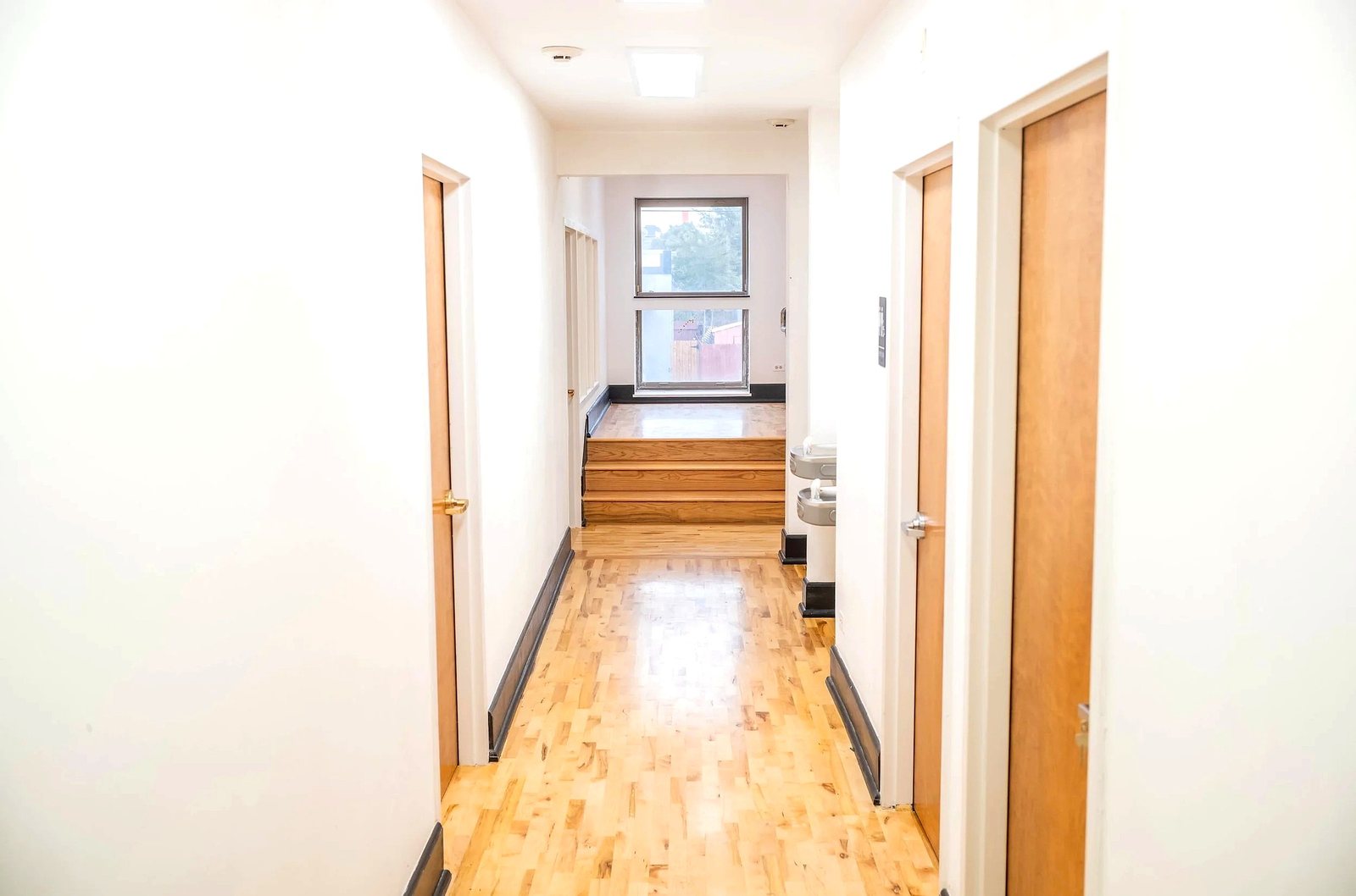 Upper level hallway to the maple tread stair